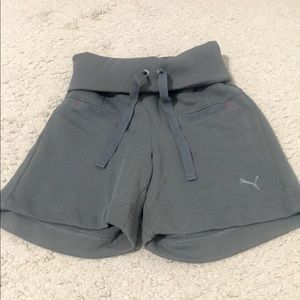 gray roll-down Puma shorts